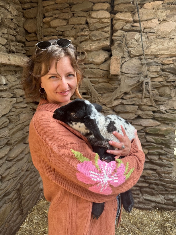 Savannah Woodward holding a baby goat Savannah Woodward holding a baby goat